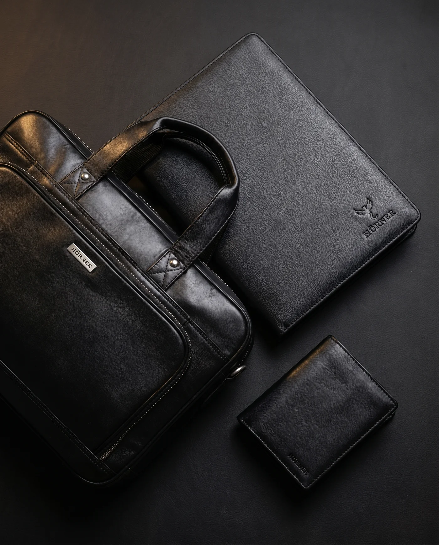 Hörner Lederwaren-Familie: Laptoptasche, Konferenzmappe und Geldbörse in Schwarz